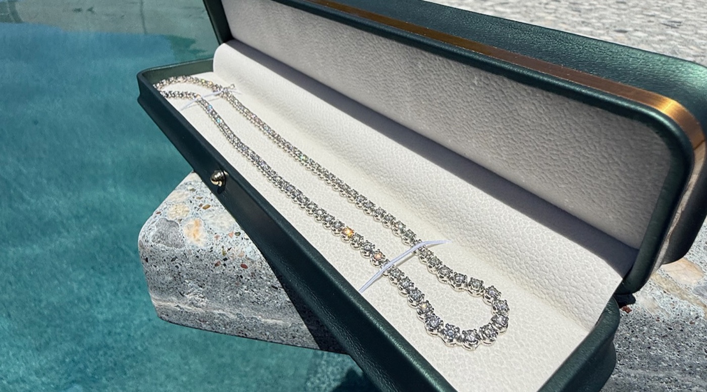 Graduated diamond tennis necklace in a presentation box
